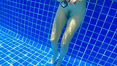 Girl fucks black dildo in public pool