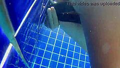 Girl fucks black dildo in public pool