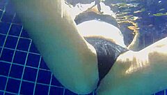 Girl fucks black dildo in public pool