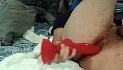 Caged Pup Plays with Bad Dragon Toy