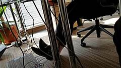 In the bustling office, a playful shoeplay moment captures attention
