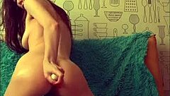 Beautiful brunette playing with her anal