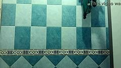 Pregnant Mexican Filipina woman showers after beach in voyeur video