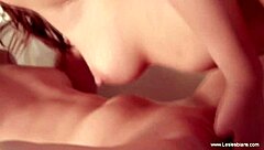 Sensual lesbian lovers kiss and connect while masturbating with toys in glamour setting