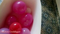 balloons in bathroom with stockings legs