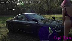 Candi Raven washing her RX7 in a tub outdoors