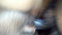 The wife moans as her creamy pussy receives a deep creampie, filling her completely with hot cum in their intimate bedroom encounter.