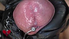 Extreme Close Up of Latex Gloves Peehole Play and Massive Cumshot Action