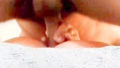 She grabs his cock tightly as he fucks her big ass passionately in close up